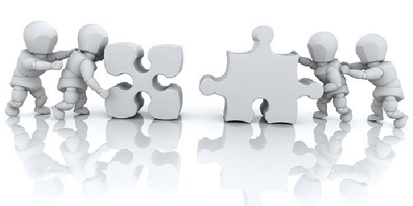 Image of people figures solving a puzzle together