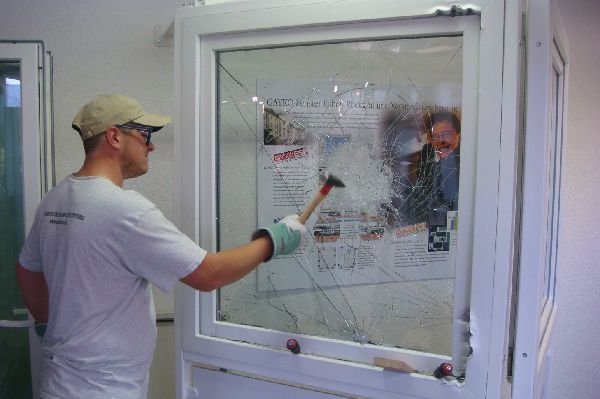 Image of full security window system being attacked